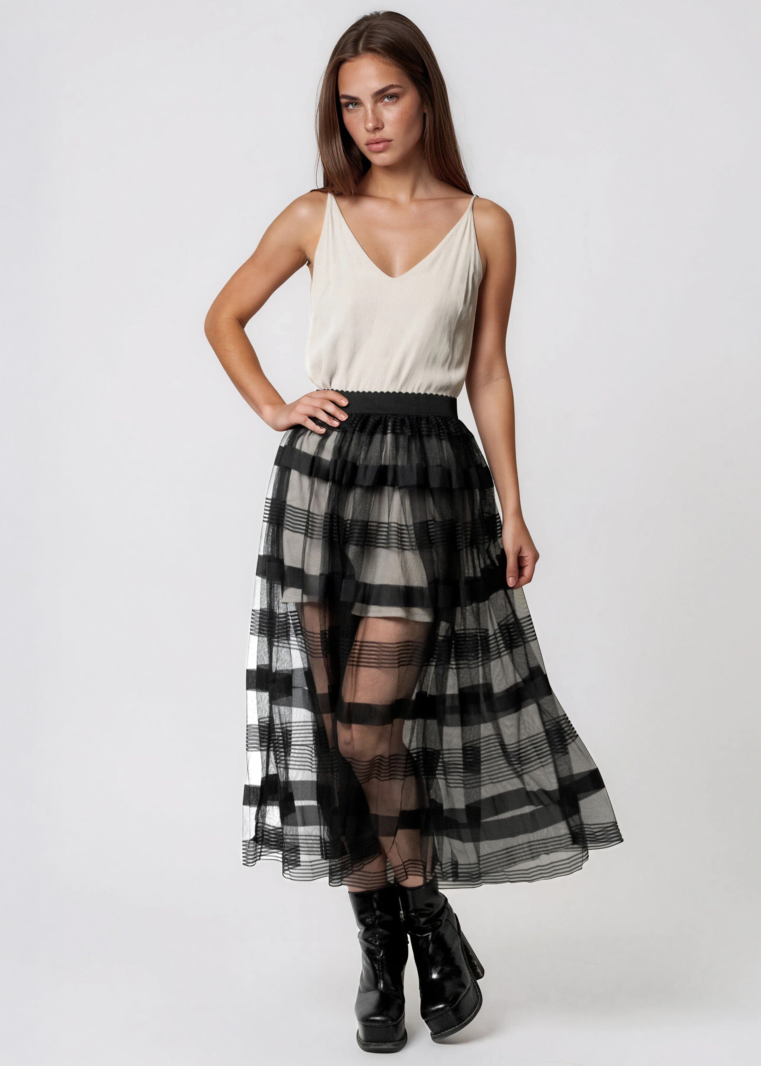 sheer skirts and dresses Lulli Emilia Mesh Long Skirt M/L / Black Elegant high neck design with long sleeves for sophisticated coverage Striking contrast between fitted knit bodice and flowing sheer maxi skirt Delicate pleating detail on the sheer skirt creates beautiful movement Versatile maxi length perfect for transitional season styling Refined silhouette that gracefully skims the bodys contours This captivating knit dress from Karen Millen masterfully combines structure and fluidity for a contemporary daywear statement Sheer Tulle Layering Skirt |